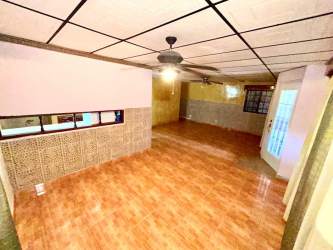 Traditional single-story home with metal gate covered porch La Chorrera Panama