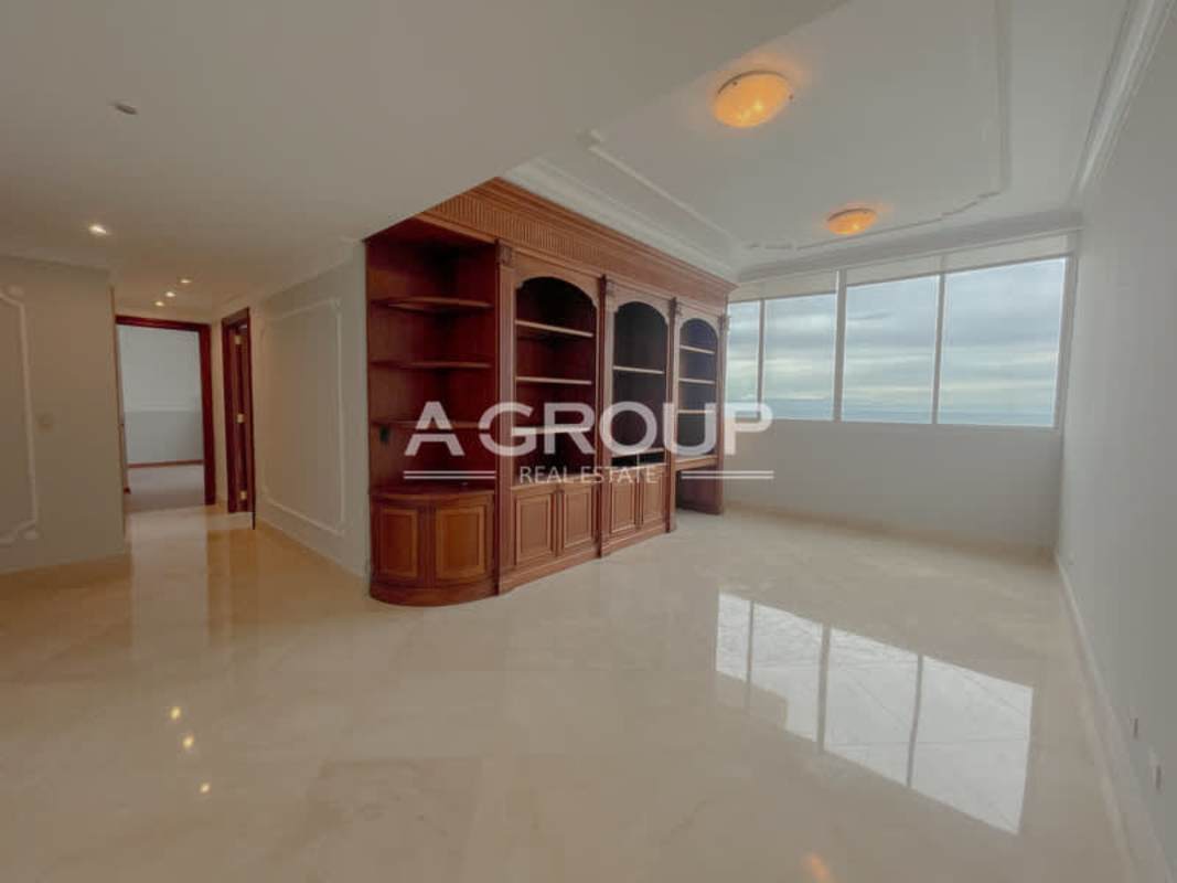 Formal living marble floor panoramic windows ocean skyline PH Punta Roca luxury condo Panama