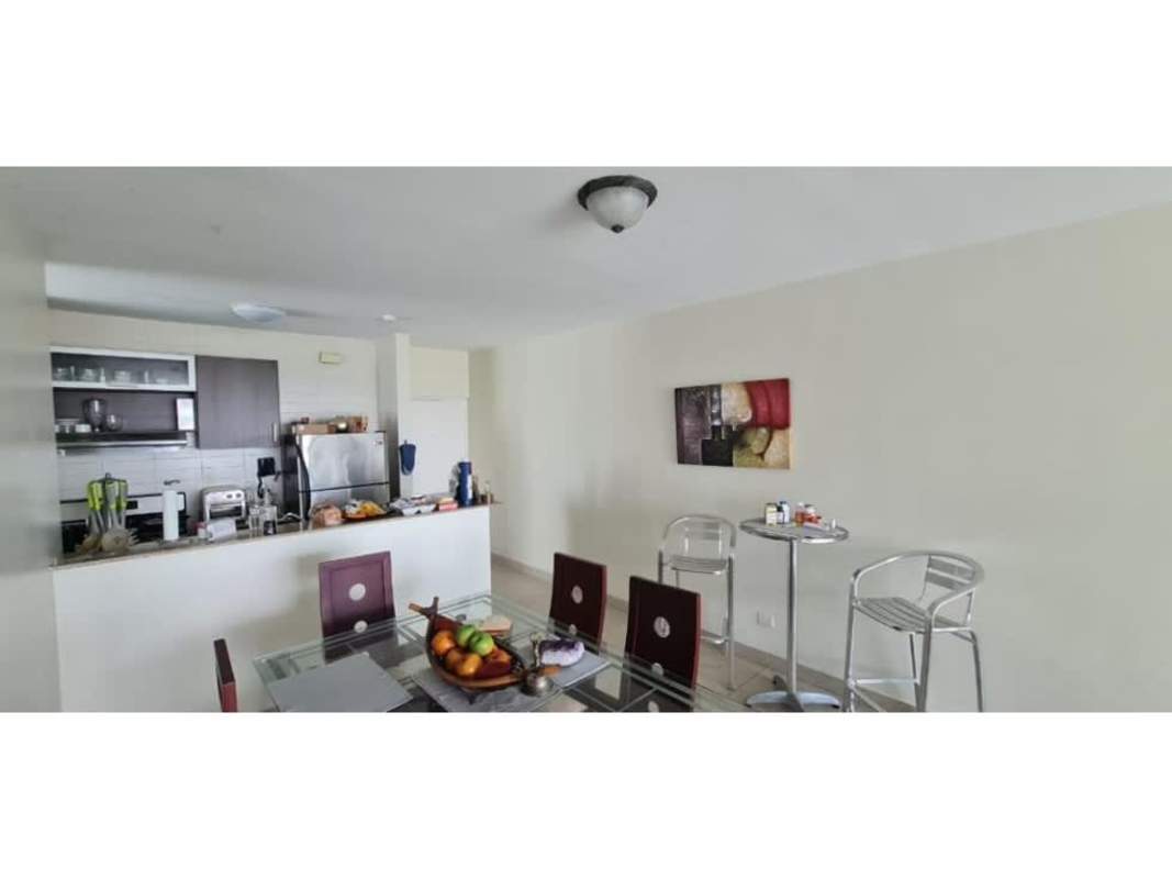 Modern kitchen and dining space with granite countertops in PH Pacific Point Punta Pacífica