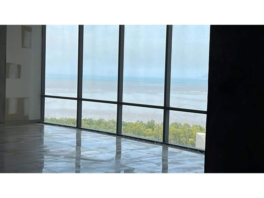 Modern interior space with marble floors, floor-to-ceiling windows and ocean views in Financial Park Tower Costa del Este Panama