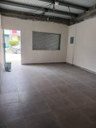 Commercial space interior with shuttered window and tiled floor Costa Verde La Chorrera