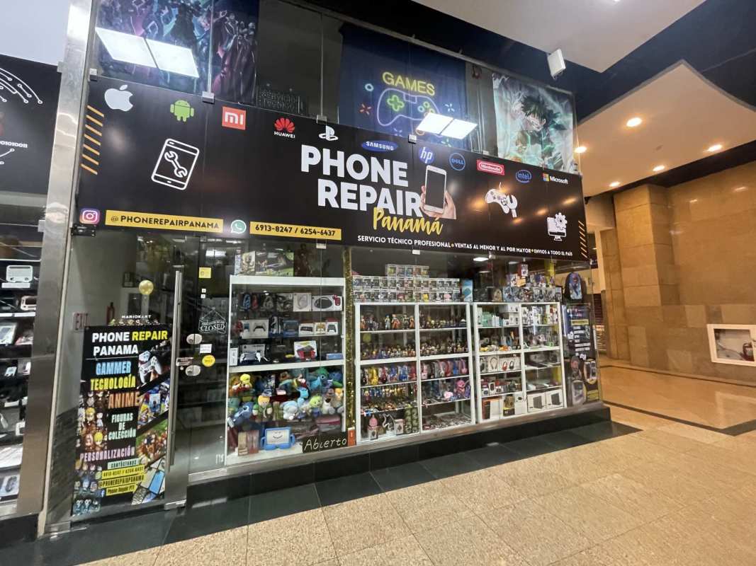 Glass storefront of commercial retail unit at Dorado Super Center mall food court area Panama City