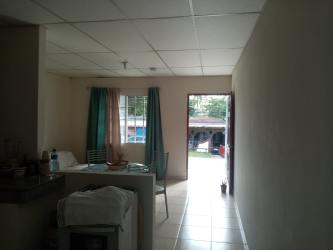 Dining with metal chairs, window with curtains, tiled floor in affordable apartment La Herradura La Chorrera Panama Oeste