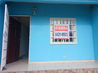 Blue-painted wall, stone trim house with secure entry in La Herradura La Chorrera affordable rental