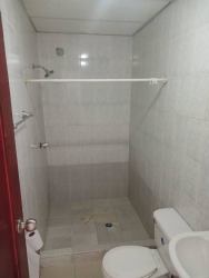 Small basic bathroom with tile finish, shower and toilet La Herradura La Chorrera apartment rental