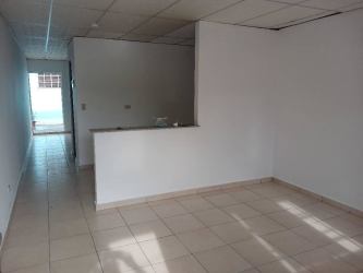 Living area with tiled floor, natural light, open kitchen view affordable rental in La Herradura La Chorrera