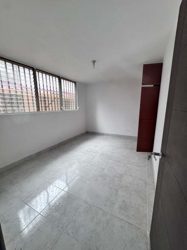 Bedroom with built-in closet, barred window, tile floor in PH El Ingenio Panama
