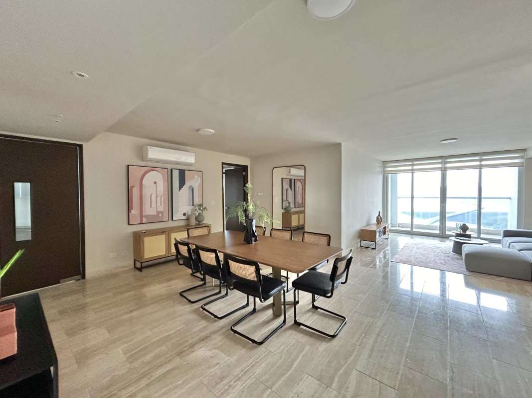 Dining area with large windows and minimalist furniture PH The Regent Costa del Este