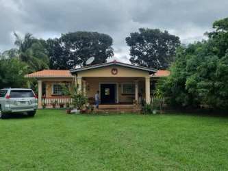 Single-story ranch style house with garden, lawn and porch in La Paz Chame Panama