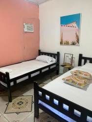 Facade of boutique hotel for sale with porch and signage Pedasí Panama real estate