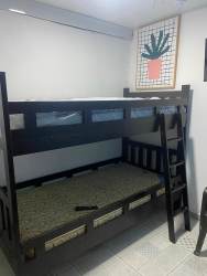 Bedroom with bunk bed and cactus wall art at hotel property Pedasí Panama