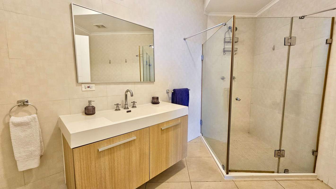 Spacious bathroom with double sink vanity and glass shower Punta Pacifica Panama