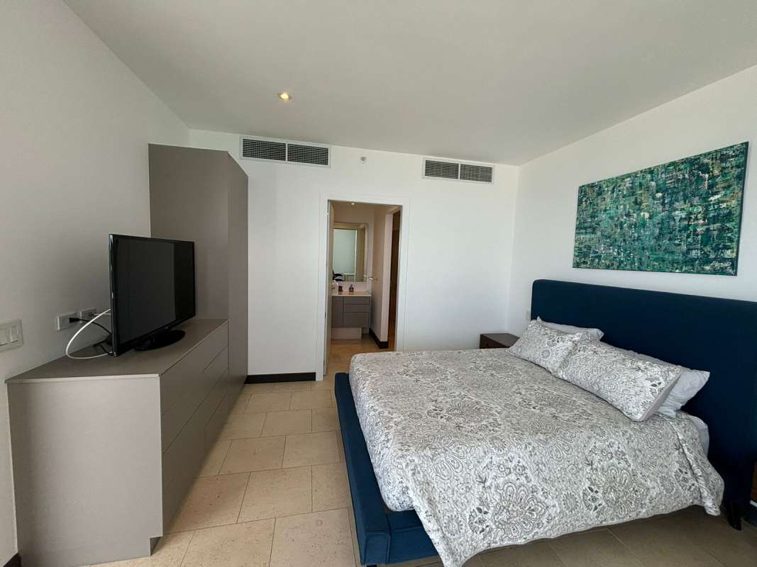 Contemporary bedroom with en-suite bathroom, neutral tones in Punta Pacífica luxury apartment