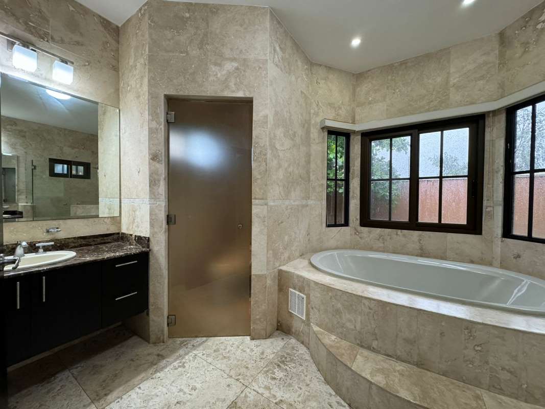 Luxury master bathroom with jacuzzi tub, marble counters PH Sunset Coast Costa Sur Panama