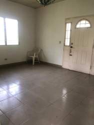 Tiled bathroom with vanity, toilet and shower at Altos de Capira country property Panama