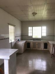 Living room or bedroom with AC unit, ceiling fan and tiled floors in Capira Panama