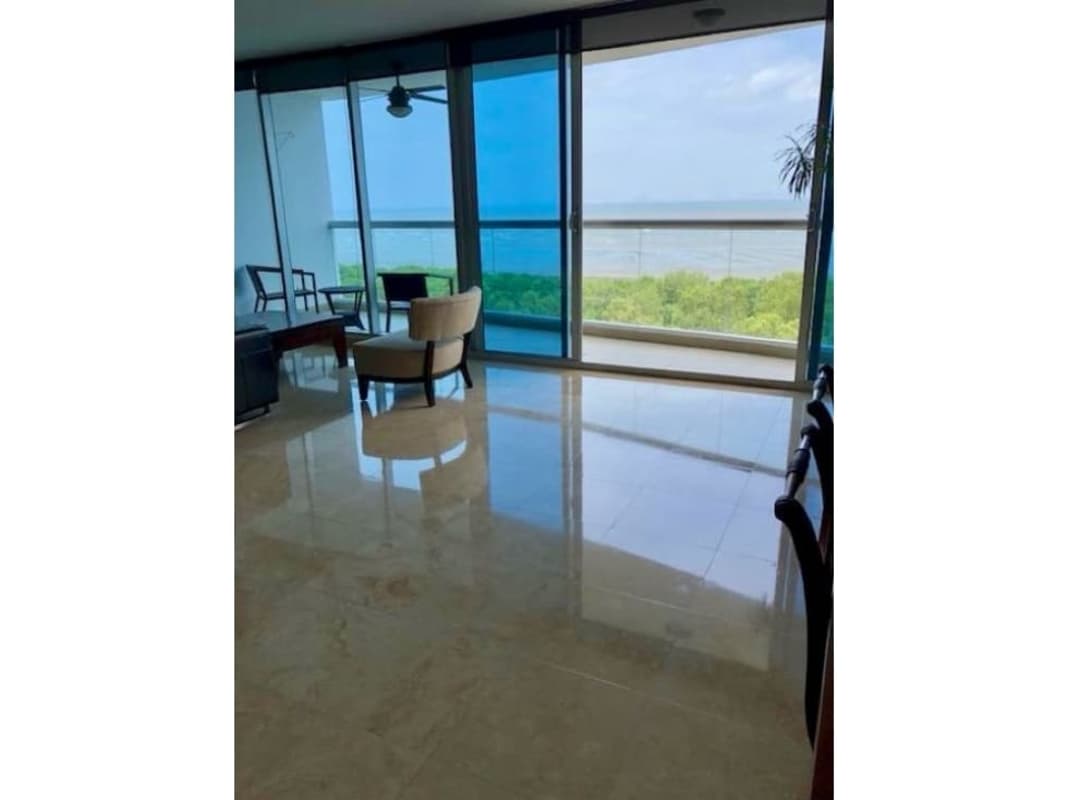 Contemporary dining room with marble floors, floor-to-ceiling glass and ocean views in PH Costa Pacifica Panama