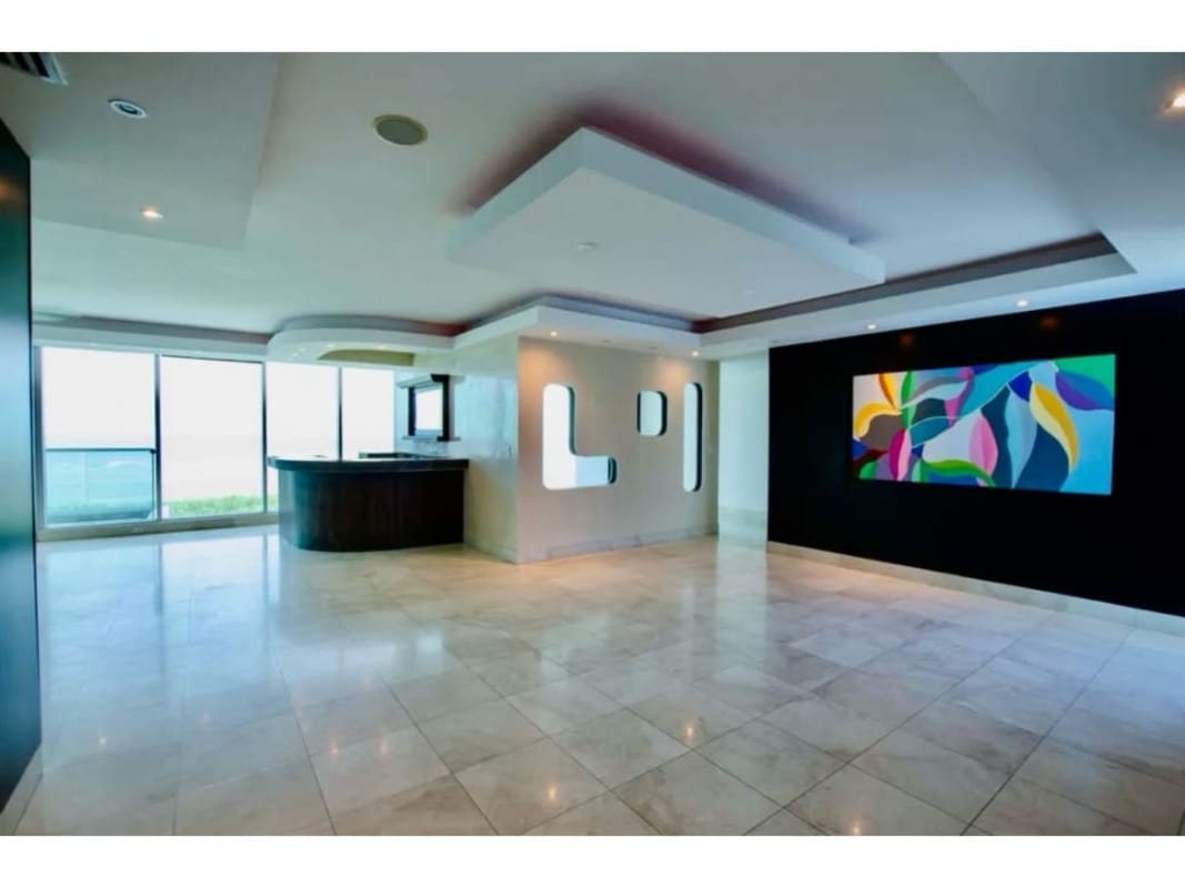 Large walk-in closet with built-in wood shelves, drawers PH Miramar Costa del Este