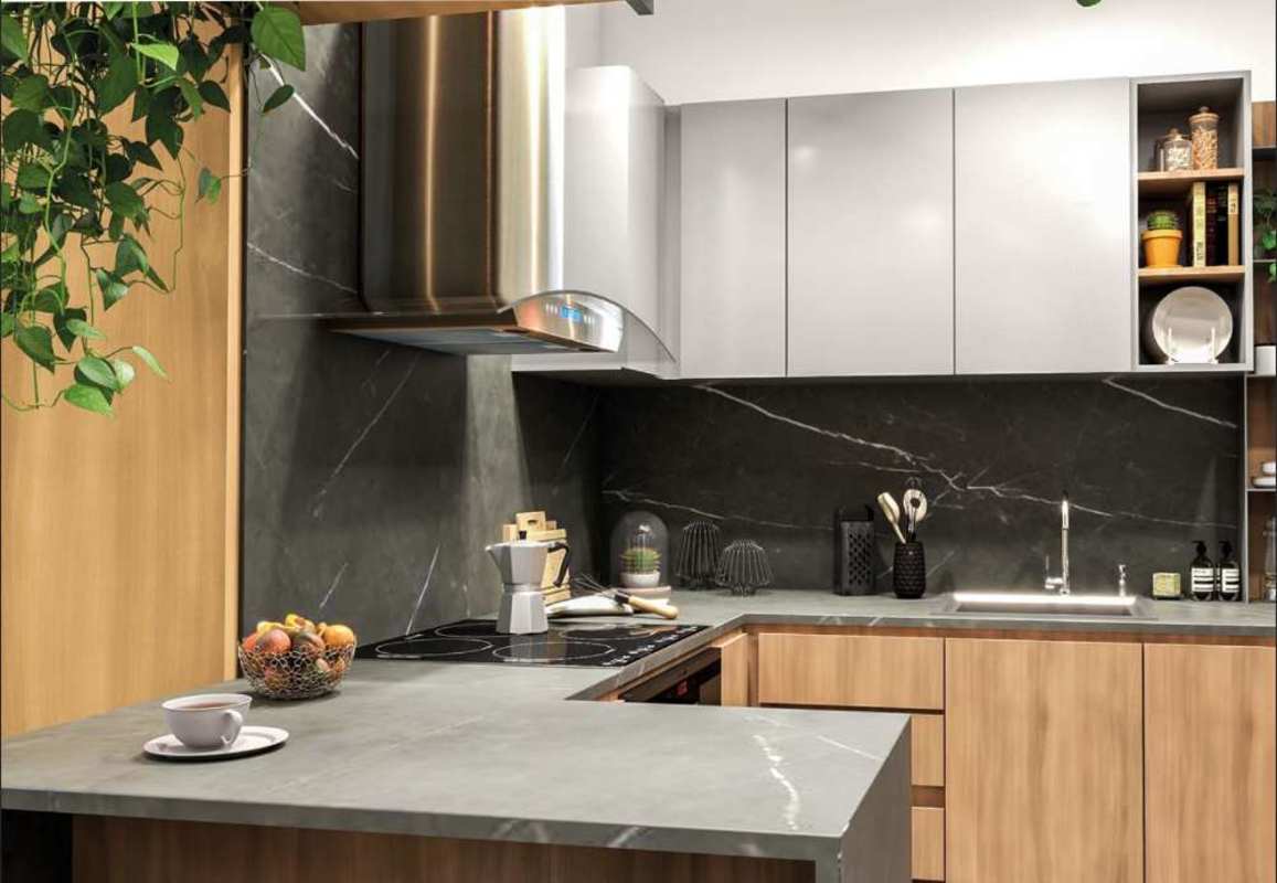 Modern kitchen with marble counters, wood cabinets in PH Next Coco del Mar Panama for sale