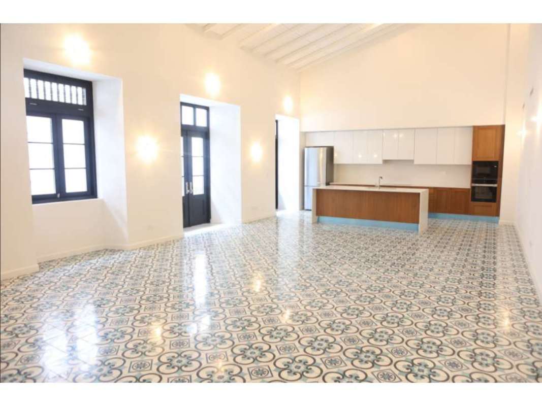 Bright kitchen dining with tile flooring, large island, high ceiling Casco Viejo Panama