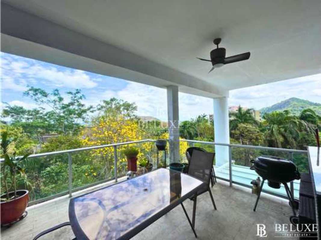 Bright living room with panoramic windows overlooking Panama Canal at PH The Bridge Amador