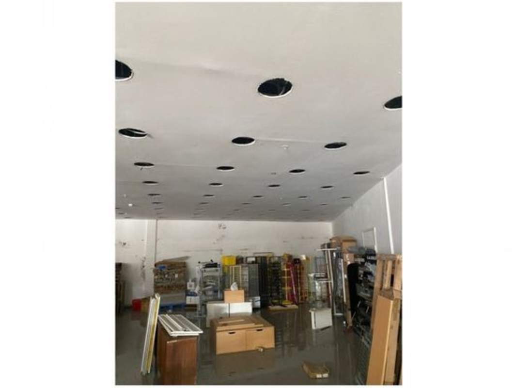 Spacious commercial interior with tiled floors and unfinished ceiling at Plaza Nuevo Tocumen retail unit Panama City