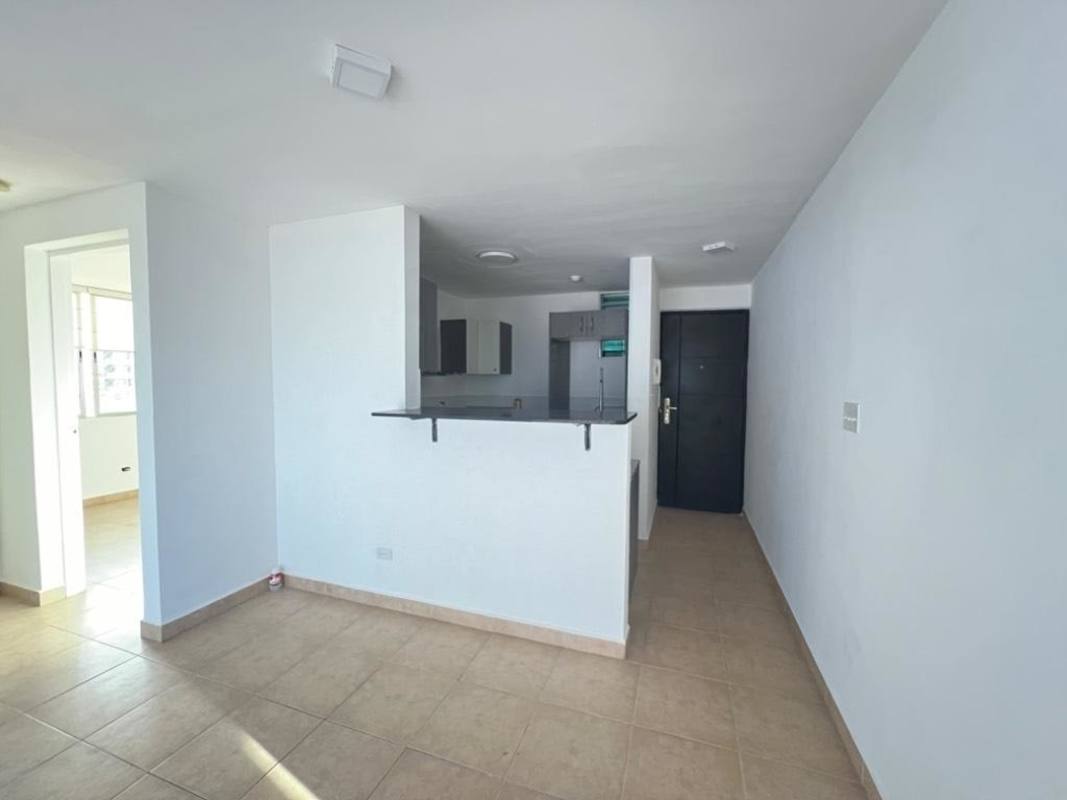 Open plan living room connected to modern kitchen bright ceramic floors PH Carrasquilla Panama