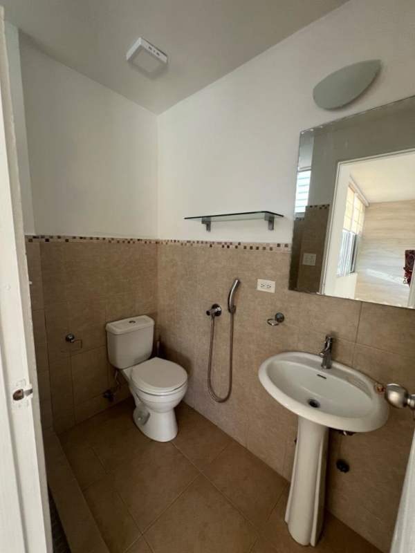 Entrance hall connecting living area bedrooms ceramic tiles PH Carrasquilla Panama