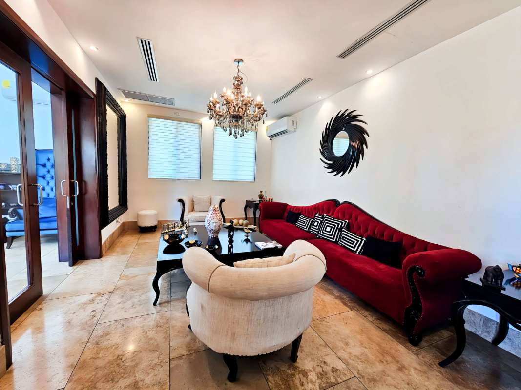 Sophisticated dining area with chandeliers and large table in Santa María Golf community Panama City