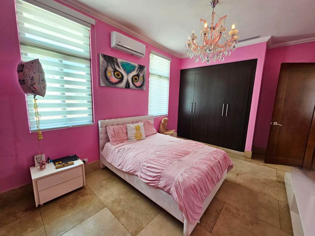 Spacious primary bedroom with balcony and golf views in Fairway Estates Santa María Panama City