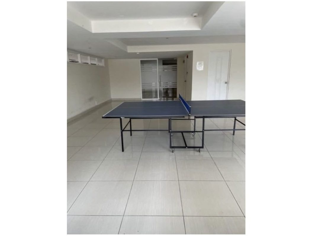 Covered colorful outdoor playground with slides and climbing wall in PH Green Park condo in Condado del Rey Panama