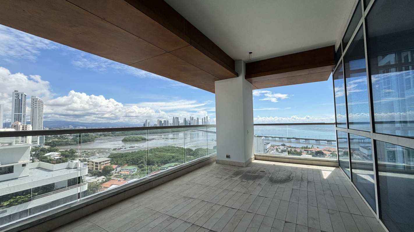 Balcony with glass railing panoramic waterfront skyline view PH Santorini Panama City