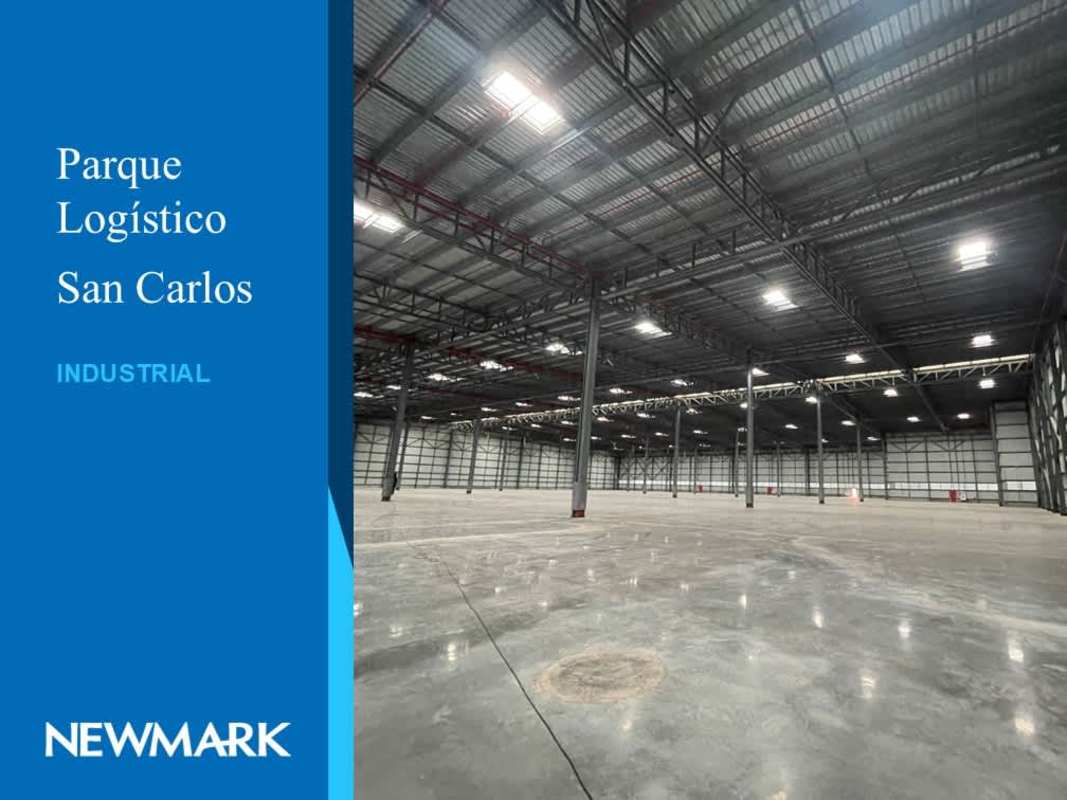 Vast open interior of industrial warehouse with metal truss roof large span Parque Logístico San Carlos Panama