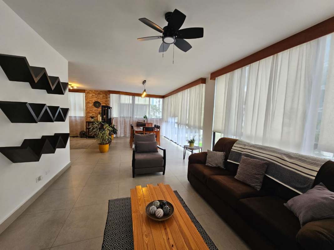 Open kitchen with granite countertops, breakfast bar, and appliances at PH Los Pilares Panama City