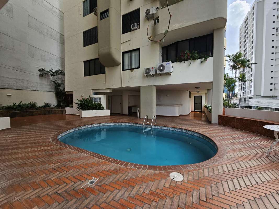 Outdoor swimming pool area with sun deck and social area at PH Los Pilares Panama City