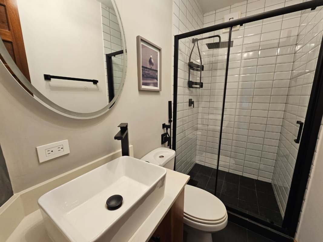 Bathroom with glass shower enclosure, modern fixtures in PH Los Pilares Panama City