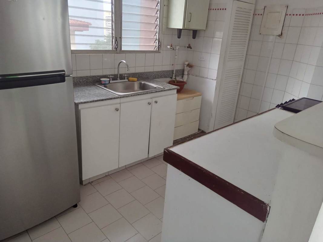 Simple kitchen with granite countertop and appliances in PH Villa de las Fuentes Panama