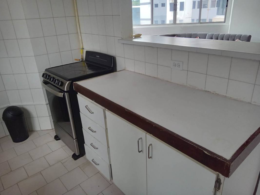 Kitchen view with breakfast bar window and gas stove PH Villa de las Fuentes Panama