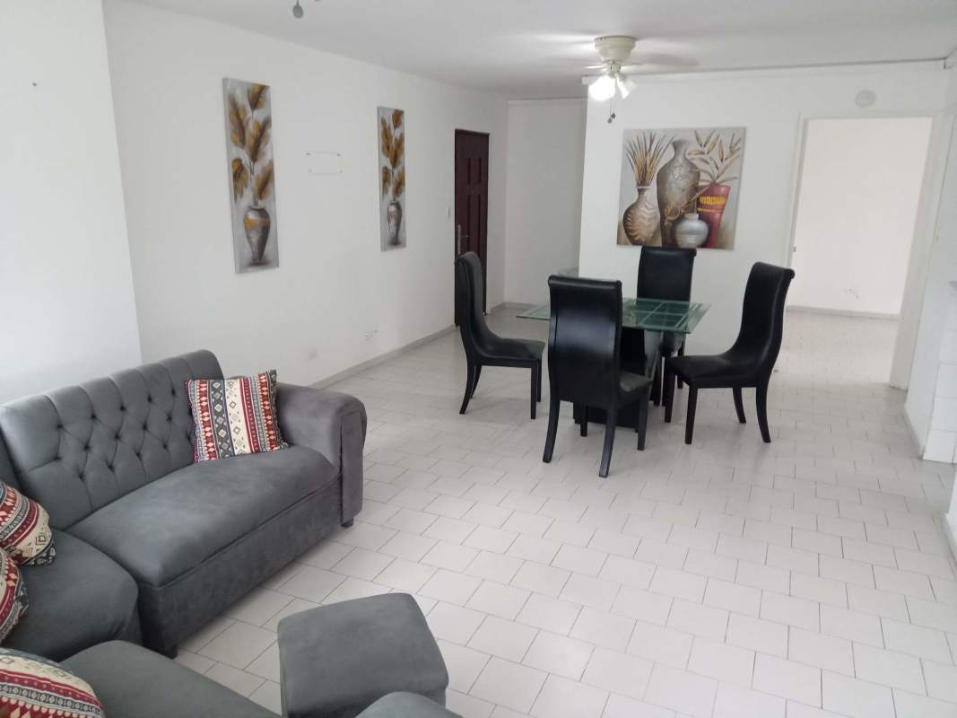 Living dining room with ceiling fan, gray sofa, tiled floors in PH Villa de las Fuentes Panama City