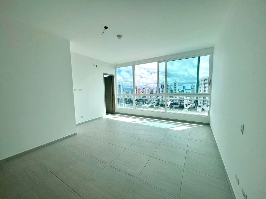 Spacious master bedroom with large windows and ocean skyline views PH The Towers luxury apartment Panama City