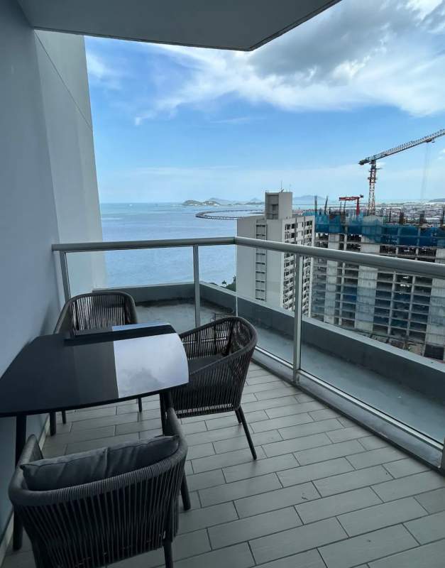 Modern bathroom with soaking tub and city skyline view in PH Yacht Club Panama City