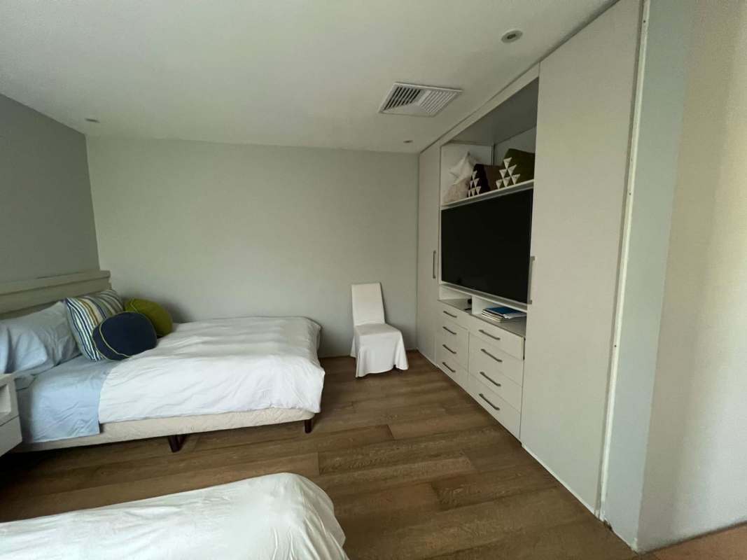 Bright double bedroom with built-in storage and Pacific sea views in Bijao Beach Condo Panama