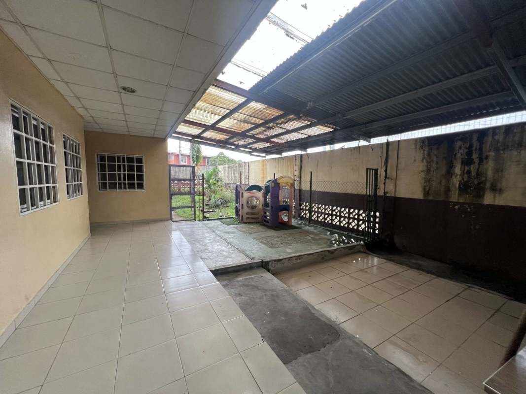 Industrial-style large open interior with tiled floor exposed beams Panama property