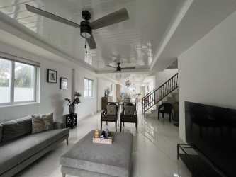 Outdoor private swimming pool with jacuzzi surrounded by stone deck Palenque Colon Caribbean property