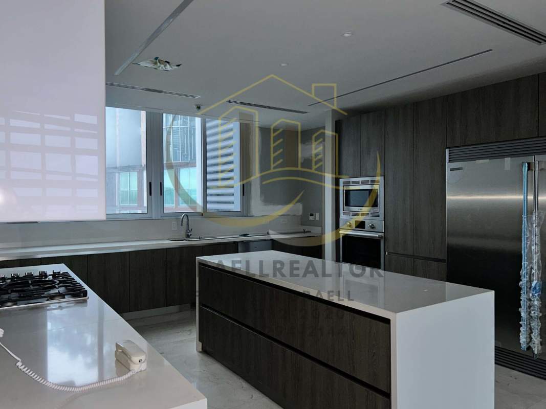 Contemporary kitchen with island, quartz countertops, stainless appliances PH Torre Panorama Panama