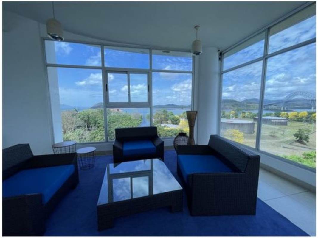 Spacious living dining open plan with large windows and ocean views at Amador Heights Panama