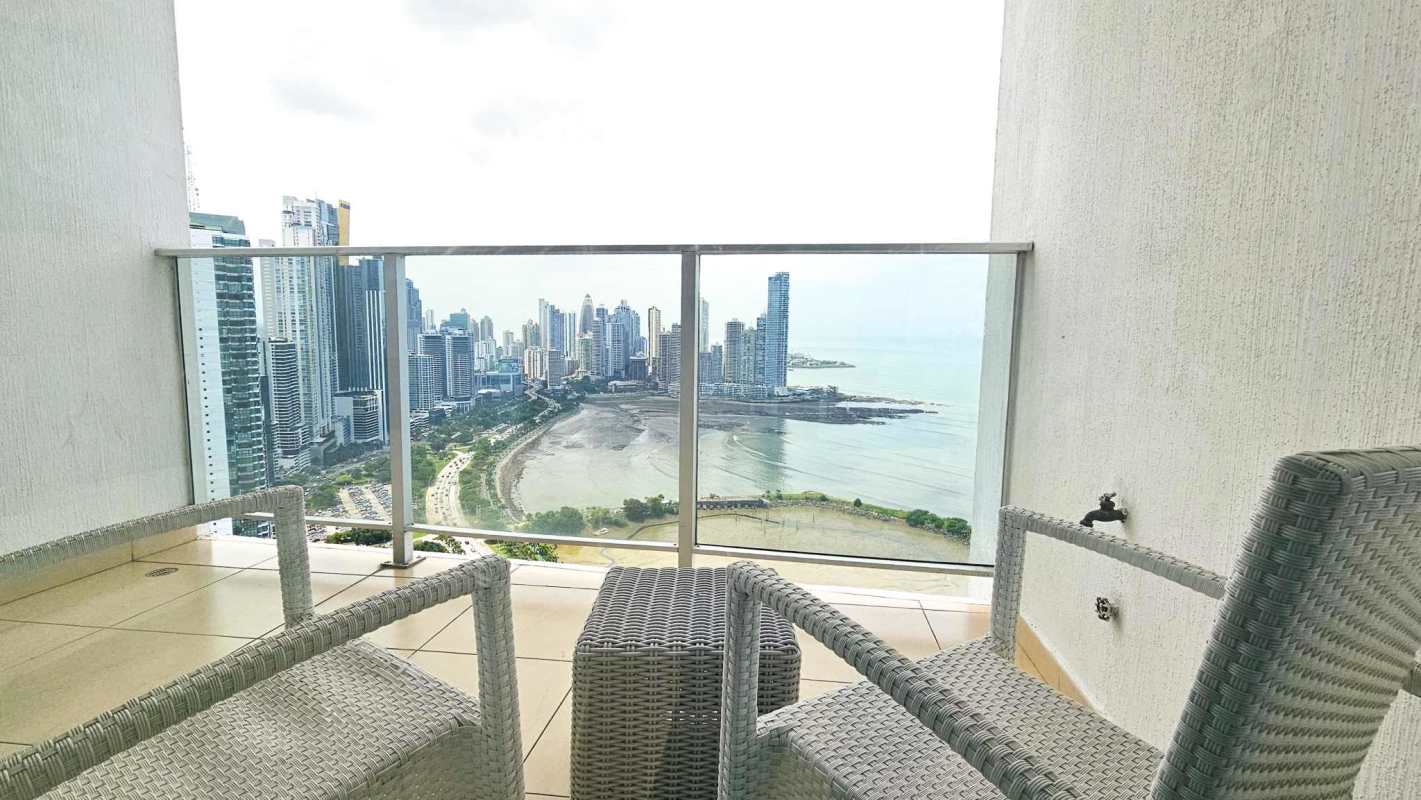 Balcony with glass panels offering waterfront skyline views at PH BICSA Tower Panama City