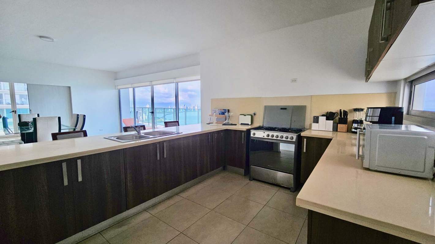 Fully equipped kitchen with appliances, granite counters and ocean view
