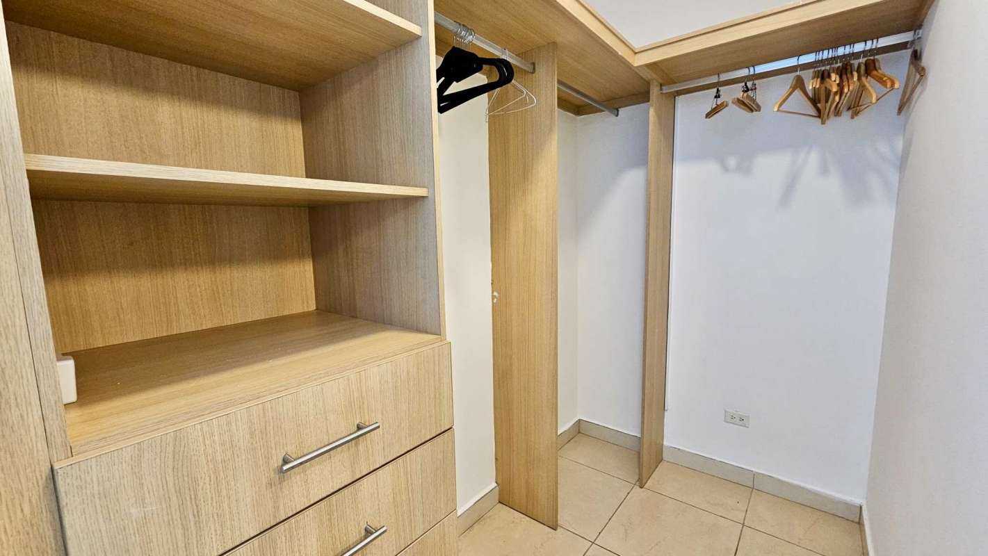 Bright second bedroom with queen bed and panoramic sea views in Amador Causeway