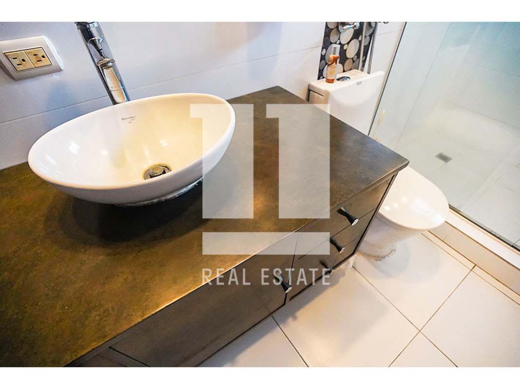 Contemporary bathroom with vessel sink and glass shower Altos del Golf Panama